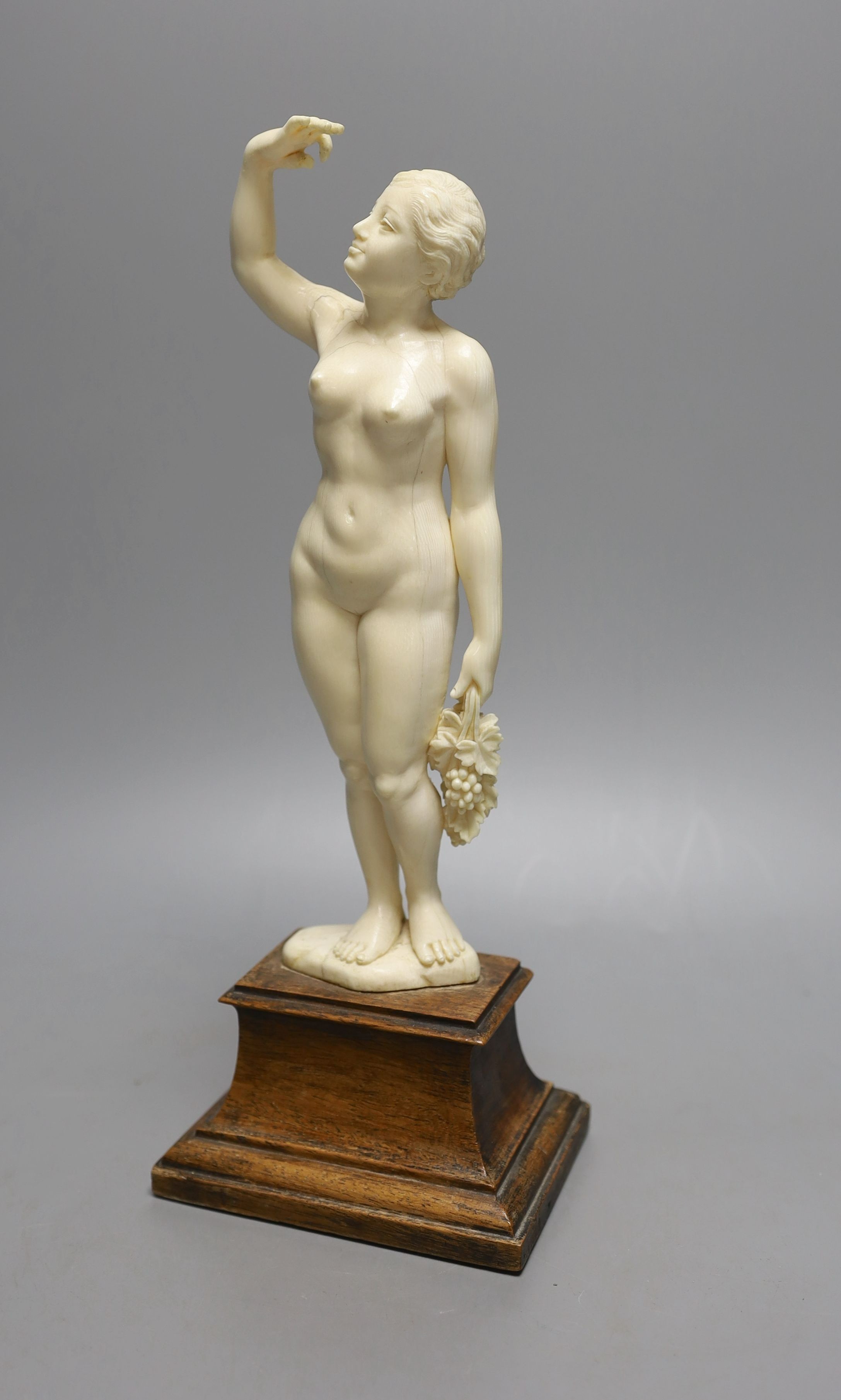 An early 20th century ivory figure of a nude maiden, possibly made in India or Burma for the European market - 32cm tall